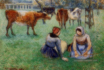 Les paysans assis regardant les vaches 1886 Camille Pissarro Peinture à l'huile
